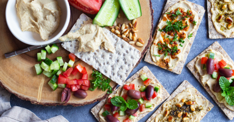 Picture of hummus and veggies on crackers