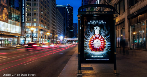 Image of DOOH ad on the side of a bus shelter on a busy Chicago street